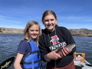 Kids fly fishing the Madison River in Montana